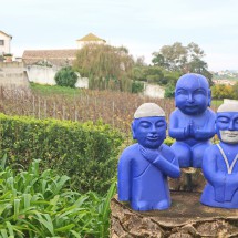 Praying blue figurines in the Bacalhôa Buddha Eden Park